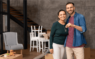 A couple holding the keys to their new home